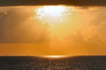 sunrise_9-13_over_galveston_ba_by_cempey.jpg